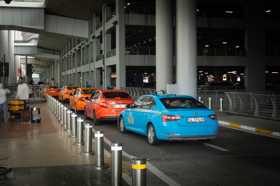The official taxi rank at Barcelona airport with passengers waiting in line