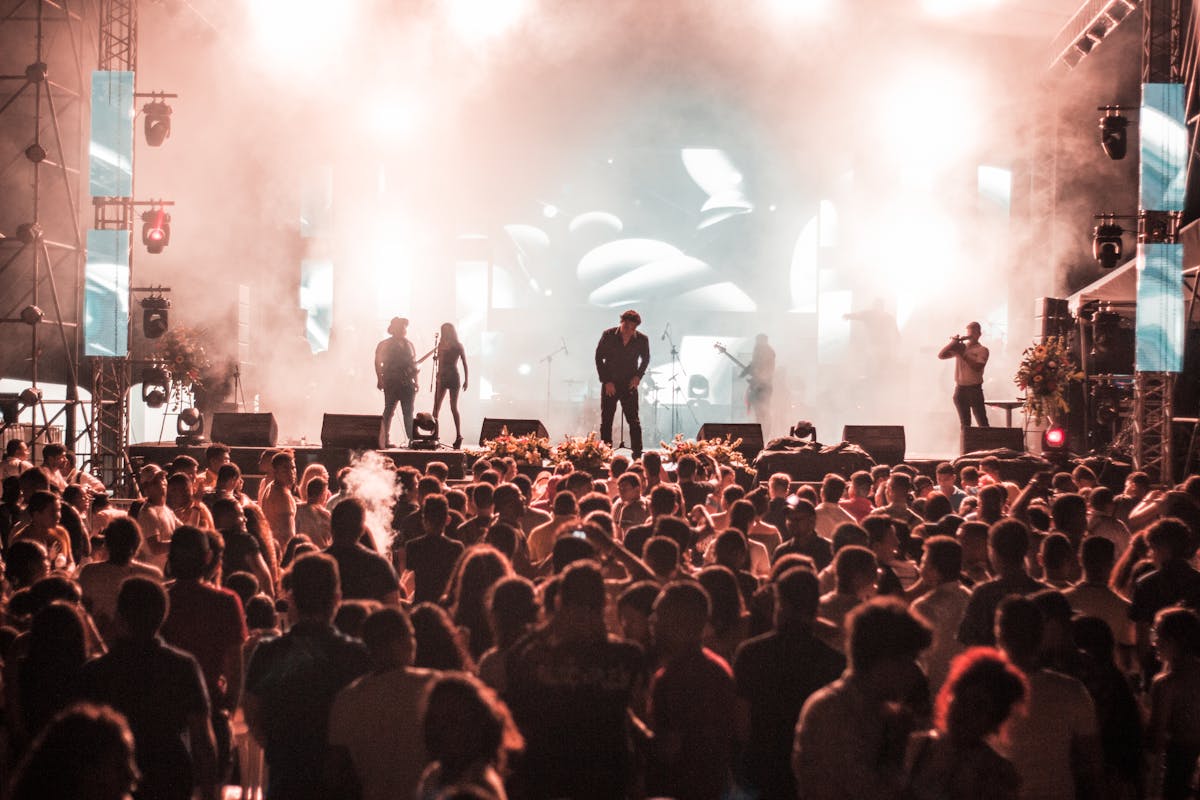 Live music performance at a Barcelona outdoor music festival with cheering audience