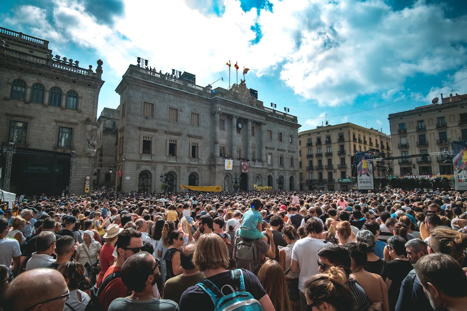 A view of Las Ramblas in Barcelona with crowds of tourists and pedestrians