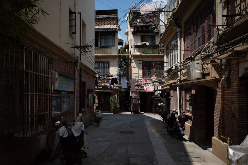 The narrow tall streets of Barceloneta with laundry hanging above the cobblestones