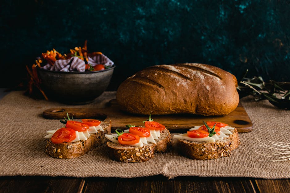 A plate of pa amb tomaquet (Catalan tomato bread) with a drizzle of olive oil and Iberian ham