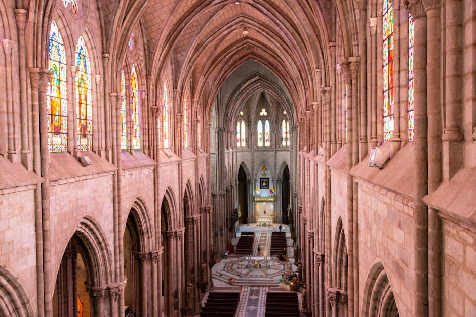 The Gothic interior of Santa Maria del Mar with light streaming through stained glass