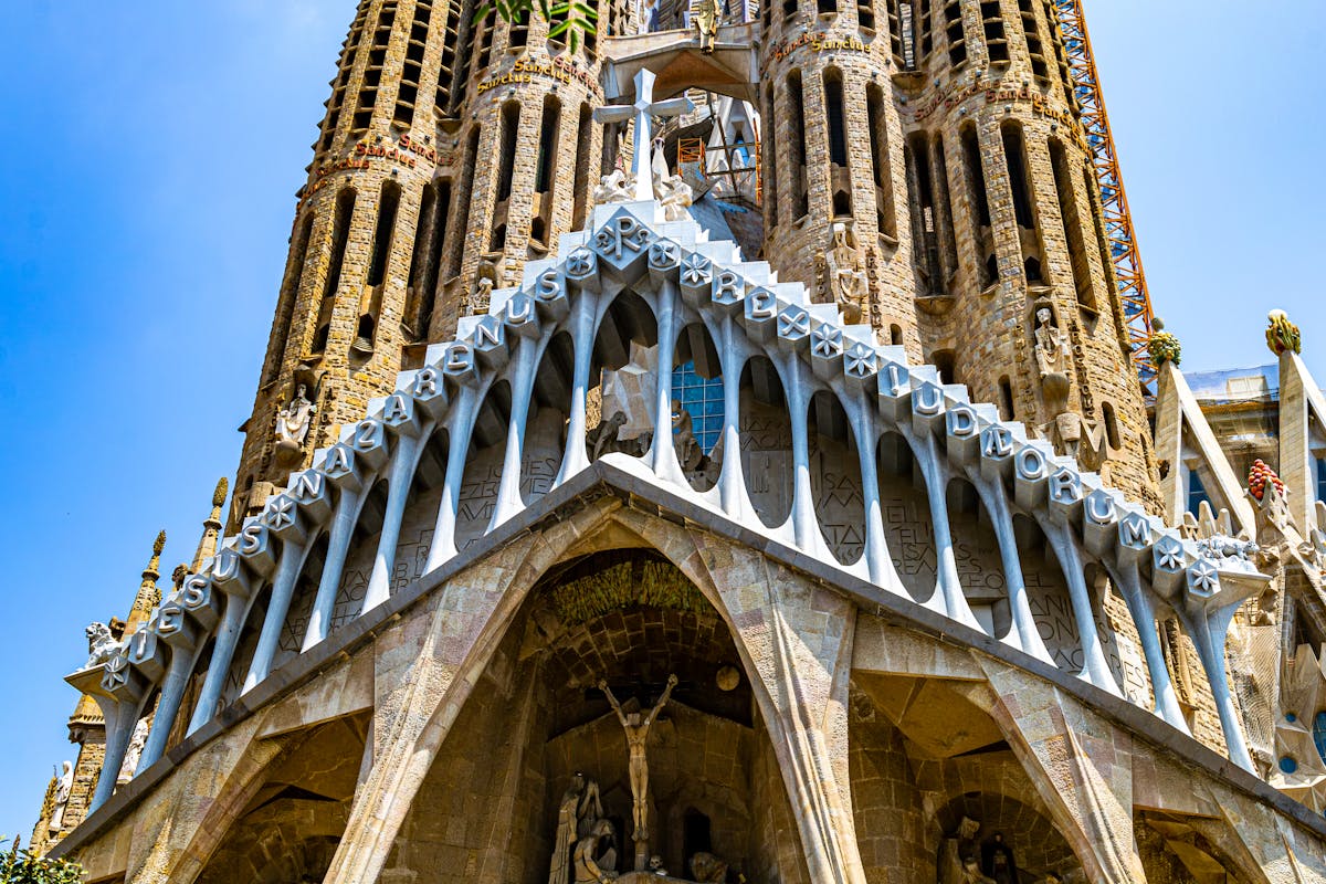 Detailed view of decorative ironwork and ceramic patterns in Gaudí architecture