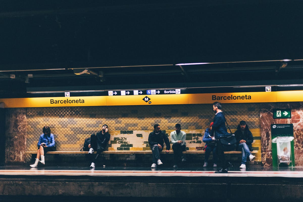 Barcelona metro station platform with modern train arriving for public transportation