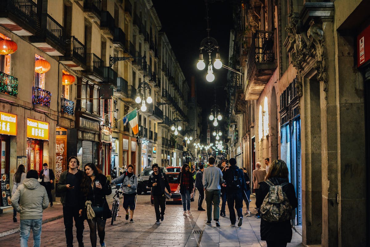 Barcelona old town Gothic Quarter at night with warm street lighting and atmospheric stone facades