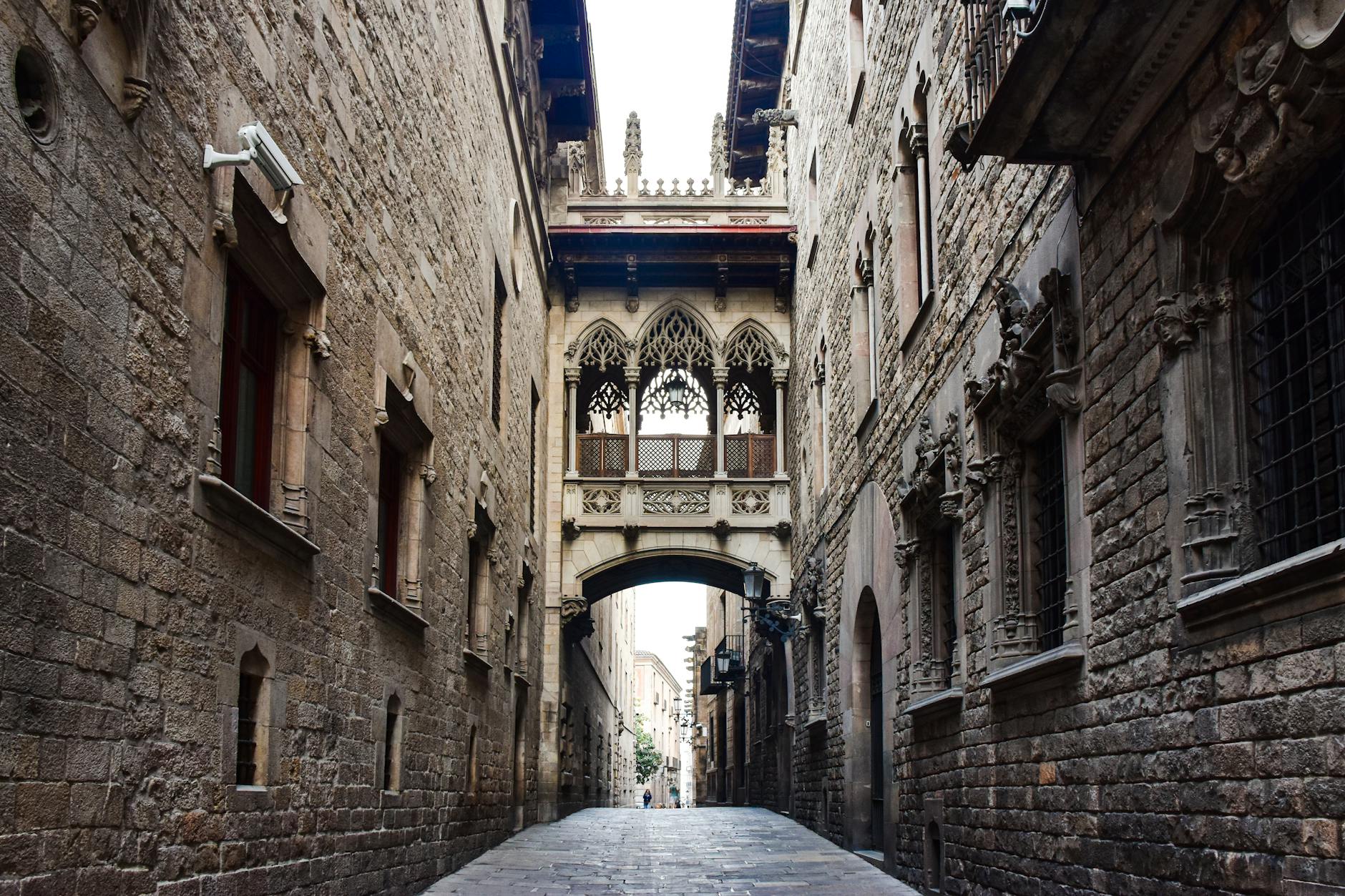 Narrow cobblestone street in Barcelona Gothic Quarter neighborhood with historic architecture