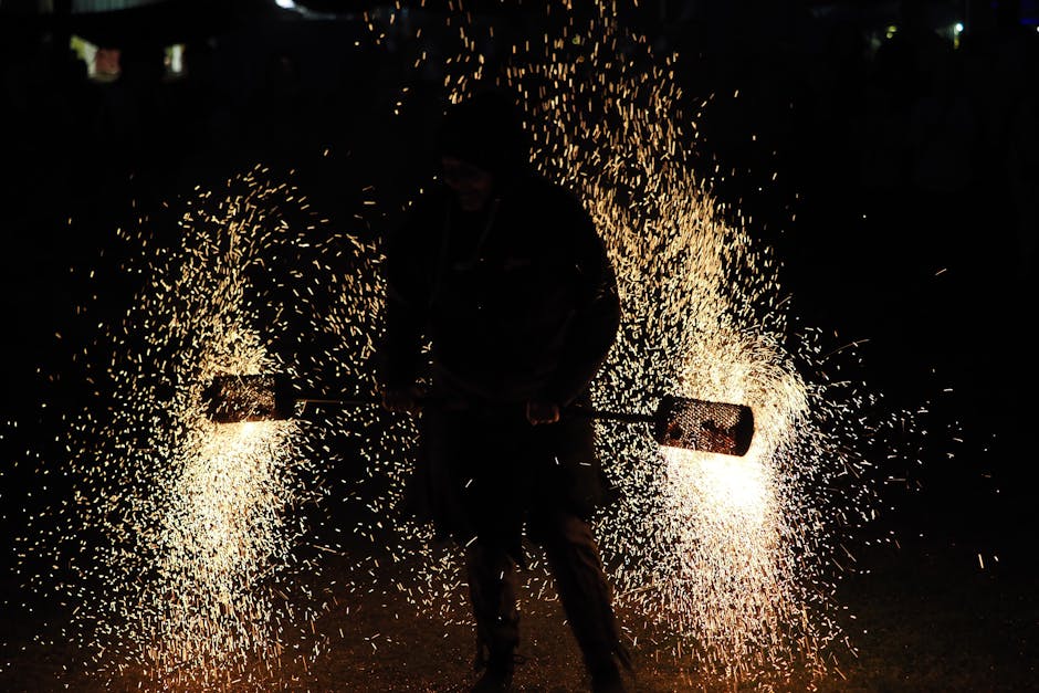 Devils with spinning sparklers race through the streets of Barcelona during a Correfoc fire run