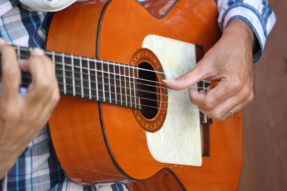 A flamenco dancer performing on a small stage in Barcelona with musicians playing guitar in the background