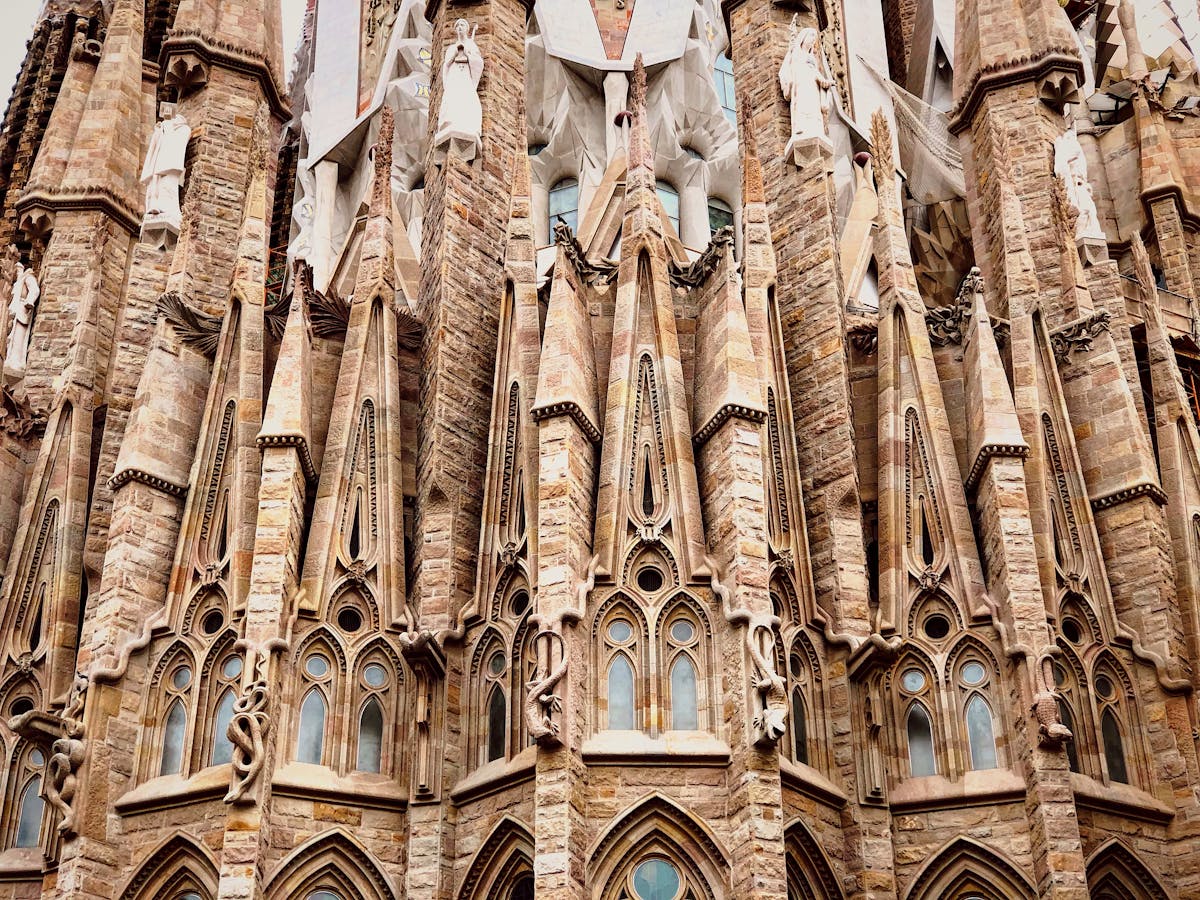 Sagrada Familia exterior view with towering spires and cranes Barcelona