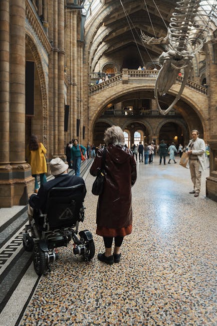 An accessible museum entrance with wheelchair ramp and accessible signage