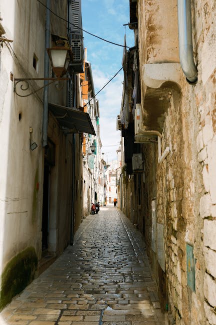 A narrow, atmospheric street in Barcelona's Old City