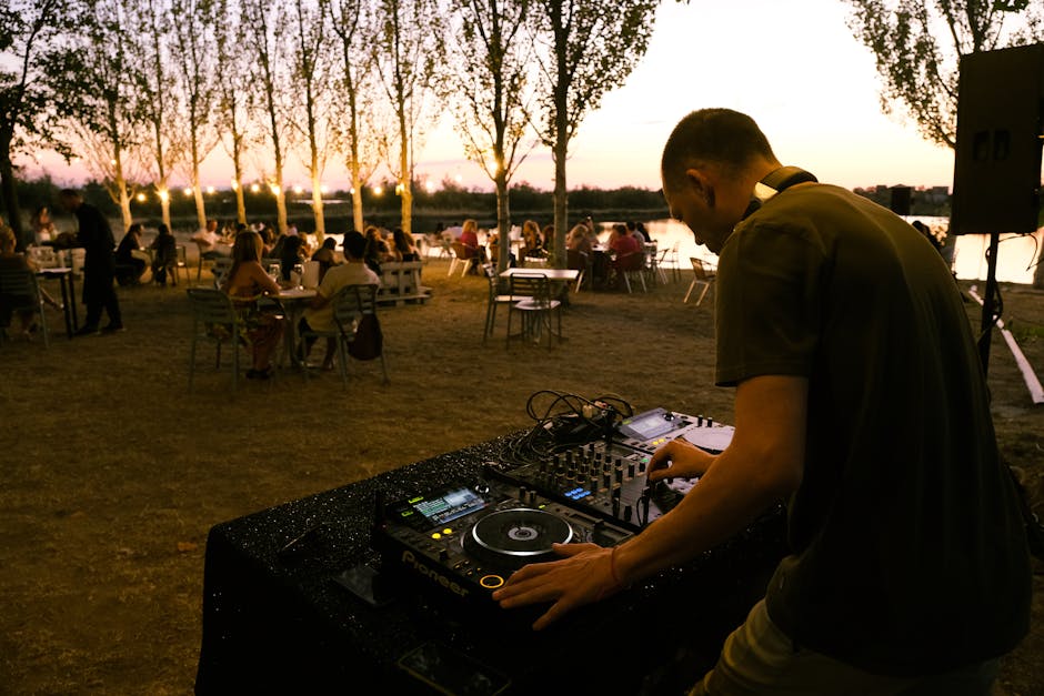 A DJ playing at a Barcelona beach club during summer