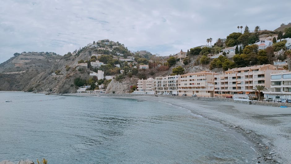 The whitewashed seafront of Sitges with church and beach below