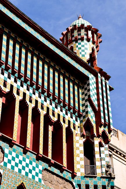 The Modernist facade of Casa Batllo with colorful tiles and curved balconies