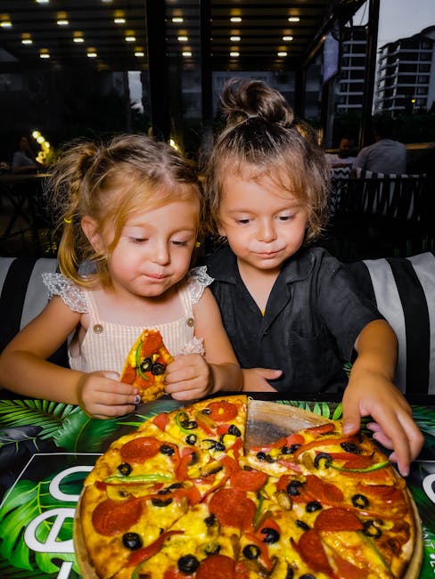 Children eating pizza at a casual Italian restaurant