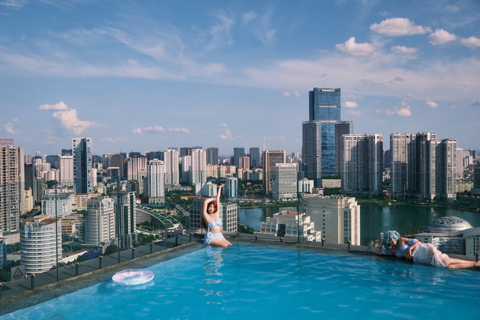 A rooftop hotel pool in Barcelona with city views