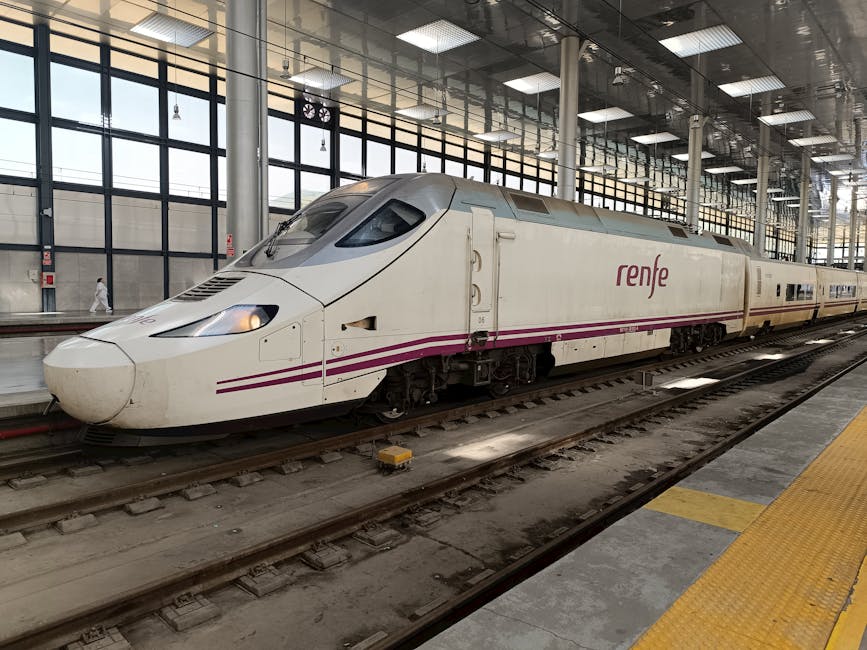 A Spanish AVE high-speed train at a Barcelona station platform