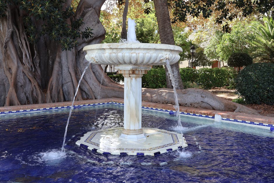 The lush gardens of Montjuic with palm trees and ornamental plants