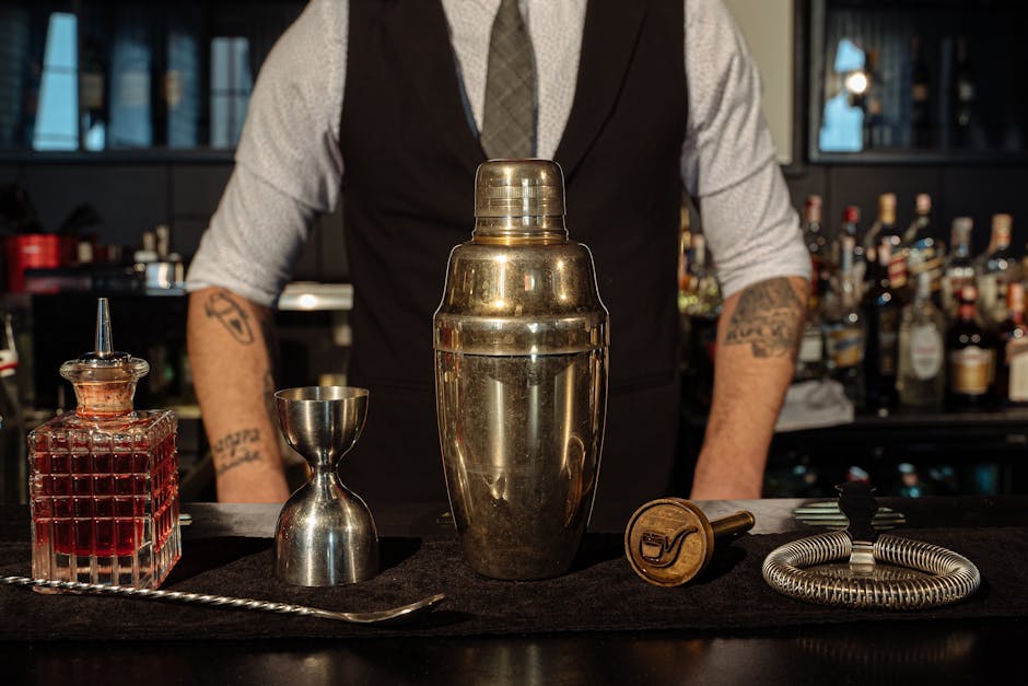 A bartender shaking cocktails at a Barcelona bar during an evening pub crawl