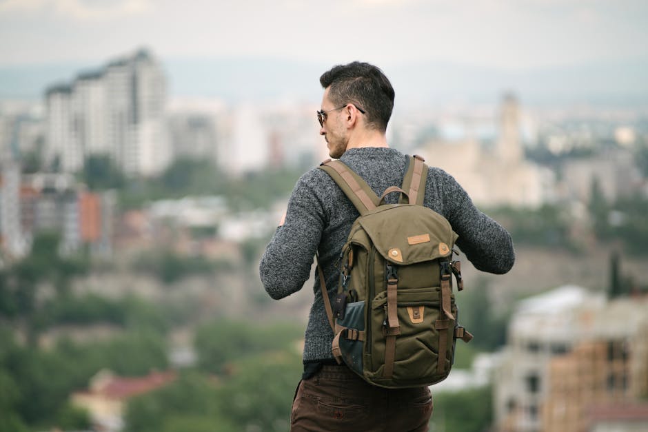 A solo traveler with backpack walking through a Spanish city