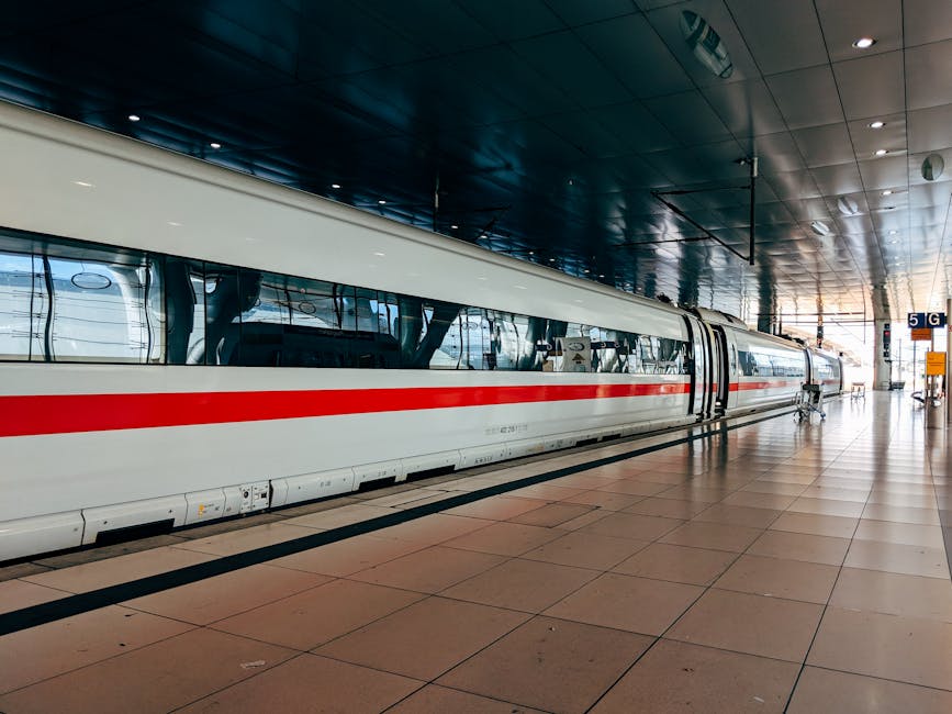An AVE high-speed train at a Spanish railway station platform