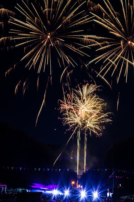 Fireworks lighting up the night sky over a summer festival
