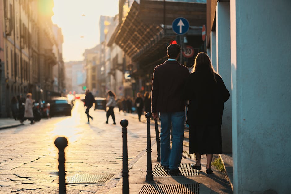 A couple walking together down a Barcelona street