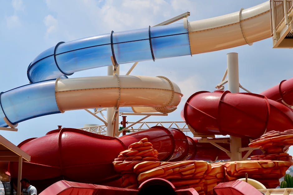 Water park slides on a summer day with families enjoying the rides