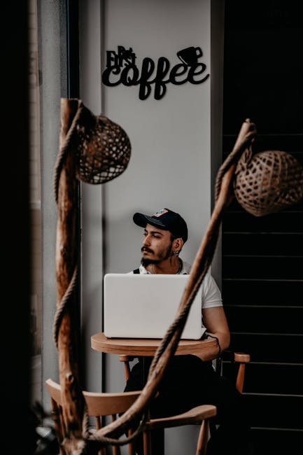 A laptop and phone connected to WiFi at a Spanish cafe
