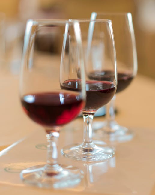 A wine tasting setup with multiple glasses for sampling different vintages