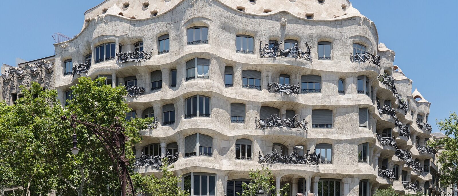 The undulating stone facade of Casa Mila on the corner of Passeig de Gracia in Barcelona